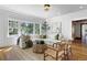Spacious living room with hardwood floors, large windows, and comfortable seating at 110 N Franklin St, Denver, CO 80218