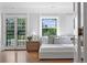 Main bedroom with hardwood floors and French doors to balcony at 110 N Franklin St, Denver, CO 80218
