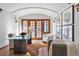 Bright home office features hardwood floors, glass-top desk, and French doors at 110 N Franklin St, Denver, CO 80218