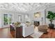 Spacious living area with fireplace, hardwood floors, and large windows at 110 N Franklin St, Denver, CO 80218