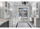 Bright bathroom with double vanity, ample storage and French doors at 110 N Franklin St, Denver, CO 80218