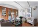 Home office with hardwood floors, French doors, and built-in shelving at 110 N Franklin St, Denver, CO 80218