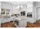 Spacious kitchen with white cabinets, granite island, and high-end appliances at 110 N Franklin St, Denver, CO 80218