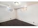 Finished basement room with dark wood flooring and natural light at 3790 W 54Th Ave, Denver, CO 80221