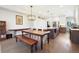 Elegant dining area with a long wooden table and bench at 3450 N Downing St # 3, Denver, CO 80205
