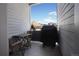 Private deck with table, chairs, and grill, offering city views at 3450 N Downing St # 3, Denver, CO 80205