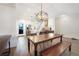 Open concept dining area with wood table and modern lighting at 3450 N Downing St # 3, Denver, CO 80205