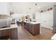 Modern kitchen island with stainless steel appliances at 3450 N Downing St # 3, Denver, CO 80205