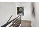 Upper hallway with modern railing and artwork at 3450 N Downing St # 3, Denver, CO 80205