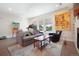 Comfortable living room with a grey sofa and large artwork at 3450 N Downing St # 3, Denver, CO 80205