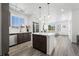 Open concept kitchen with an island and stainless steel appliances at 18633 Stroh Rd # 1-102, Parker, CO 80134