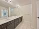 Double vanity bathroom with dark brown cabinets at 7264 Siena Way # C, Boulder, CO 80301