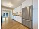 Bright kitchen featuring stainless steel appliances and white cabinetry at 7264 Siena Way # C, Boulder, CO 80301