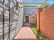 Private gated entrance with brick walkway and pergola at 7264 Siena Way # C, Boulder, CO 80301