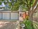 Exterior view of a townhome with a courtyard and double garage at 7264 Siena Way # C, Boulder, CO 80301