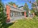 Home's exterior showcasing a brick patio and pergola at 7264 Siena Way # C, Boulder, CO 80301