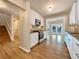 Updated kitchen with white shaker cabinets and granite countertops at 7264 Siena Way # C, Boulder, CO 80301