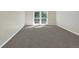 Bright bedroom with gray carpet and access to balcony at 7264 Siena Way # C, Boulder, CO 80301