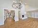 Bright living room with hardwood floors, fireplace, and kitchen view at 7264 Siena Way # C, Boulder, CO 80301