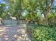Home exterior with a three-car garage and lush landscaping at 7264 Siena Way # C, Boulder, CO 80301