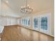 Bright living room featuring hardwood floors, built-in shelving and French doors at 7264 Siena Way # C, Boulder, CO 80301