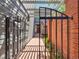 Private gated entrance with brick walkway and pergola at 7264 Siena Way # C, Boulder, CO 80301