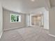 Spacious bedroom with gray carpeting and window at 7264 Siena Way # C, Boulder, CO 80301