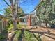 Landscaped backyard with gravel and a large tree at 7264 Siena Way # C, Boulder, CO 80301