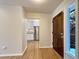 Bright entryway with hardwood floors and view into kitchen at 7264 Siena Way # C, Boulder, CO 80301