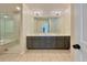 Elegant bathroom with double vanity, large mirror, and a walk-in shower at 7264 Siena Way # C, Boulder, CO 80301