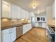 Updated kitchen with white cabinets, granite counters, and stainless steel appliances at 7264 Siena Way # C, Boulder, CO 80301