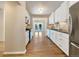 Modern kitchen with white cabinets, granite countertops, and stainless steel appliances at 7264 Siena Way # C, Boulder, CO 80301