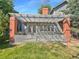 Charming patio with pergola, brick pillars, and a gray fence at 7264 Siena Way # C, Boulder, CO 80301