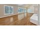 Hardwood floor living room with fireplace and large windows at 7264 Siena Way # C, Boulder, CO 80301