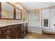 Elegant bathroom with double vanity and soaking tub at 23450 Bent Oaks Way, Parker, CO 80138