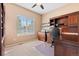 Functional home office with built-in cabinetry and a large desk at 23450 Bent Oaks Way, Parker, CO 80138