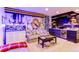Basement features a wet bar, lounge area and a Real Madrid themed wall at 6043 N Nepal St, Aurora, CO 80019