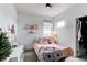 Cozy bedroom with a double bed and a vanity area at 6043 N Nepal St, Aurora, CO 80019