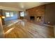 Living room features hardwood floors and a brick fireplace at 3901 E Orchard Rd, Centennial, CO 80121