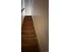 View of wooden stairs leading to the upper level of the house at 3901 E Orchard Rd, Centennial, CO 80121