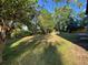 Large grassy backyard with trees and landscaping at 3901 E Orchard Rd, Centennial, CO 80121