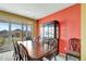 Dining room with rich wood table and access to back patio at 27646 E 10Th Dr, Aurora, CO 80018