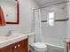 Clean bathroom with white subway tile and a tub shower at 2660 Utica St, Denver, CO 80212