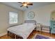Cozy bedroom with a double bed and hardwood floors at 2660 Utica St, Denver, CO 80212