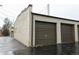 Two-car garage with brown roll-up doors at 2660 Utica St, Denver, CO 80212