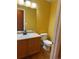 Simple, clean bathroom with wood cabinets and neutral color palette at 12578 Dexter Way, Thornton, CO 80241