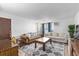 Living room with sofa, coffee table, and large TV at 381 S Ames St # B103, Lakewood, CO 80226
