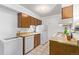 Small kitchen with wood cabinets and appliances at 381 S Ames St # B103, Lakewood, CO 80226