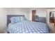Cozy bedroom with full bed and gray headboard at 381 S Ames St # B103, Lakewood, CO 80226