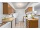 Small kitchen with wood cabinets and appliances at 381 S Ames St # B103, Lakewood, CO 80226